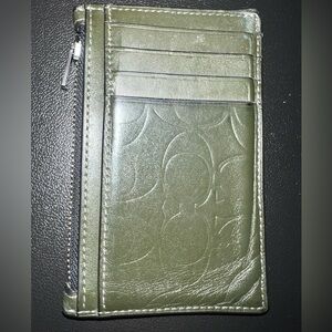 Men’s hunter green Coach wallet.